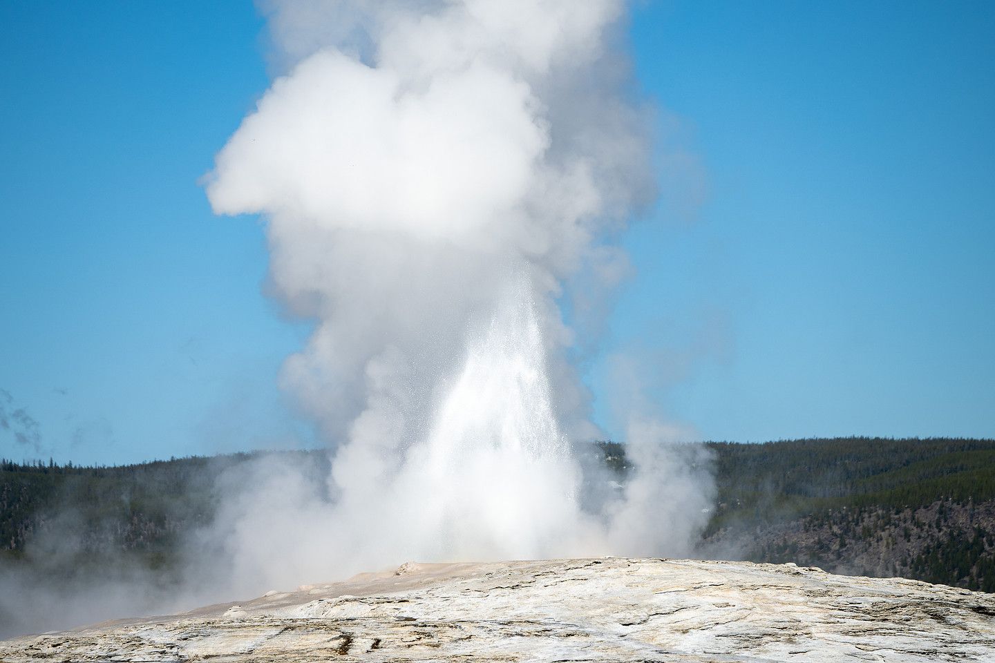 Old Faithful erupting in Yellowstone National Park